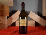 a bottle of wine that is sitting on a table