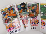 three packs of naruto trading cards on a white surface