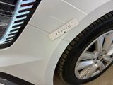 a white car with a sticker on the side of it