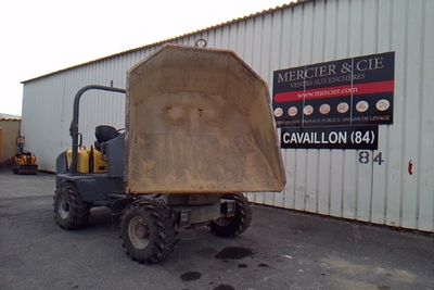 a picture of a dump truck parked in front of a building