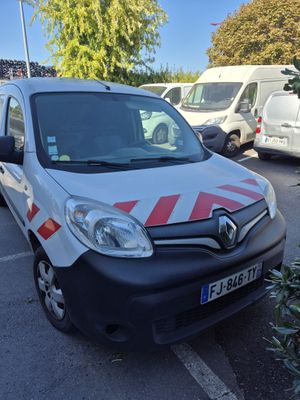 a white van with red stripes parked in a parking lot