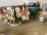 many vases that are sitting on a table