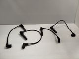 two headset microphones on a white surface with a white background