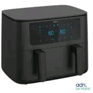 the air fryer is black and has a digital clock on it