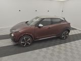 a picture of a red car parked in a garage