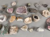 various rocks and stones are arranged in a circle on a table