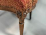 an old chair with a red upholstered upholstered upholstered upholstered upholstered