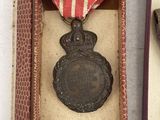 an image of a medal and a medal in a box
