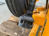 a close up of a cable connected to a wheel on a pallet