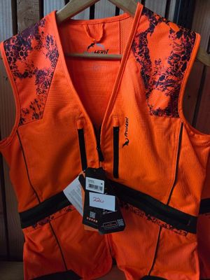 an orange safety vest with a tag on it hanging on a rack