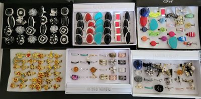 many different types of jewelry displayed in a box