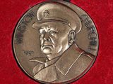a medal with a picture of a man in a military uniform on it
