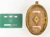 a gold locke with a green card next to it