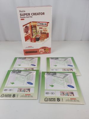 three sets of brochures are sitting on a table in front of a box