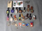 a lot of pins and badges on a table