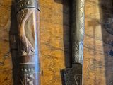 two different types of knives on a wooden table