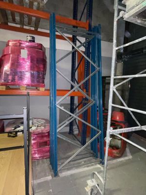 a shelf with a lot of pink plastic containers on it