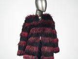 a mannequin mannequin wearing a red and black fur coat