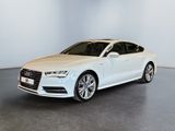 a white audi sedan parked in a white room