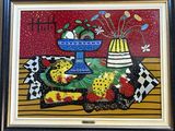 tableau encadré représentant des fruits et des fleurs posés sur une table
