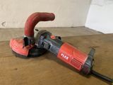 a red and black electric polisher on a wooden table