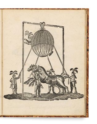 un vieux livre sur lequel figure le dessin d'un homme à cheval et d'un homme à cheval