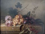 un tableau représentant un panier de fruits posé sur une table