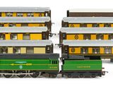 two trains that are sitting next to each other on the tracks