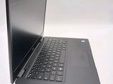 a laptop that is open on a white surface