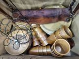 a box full of wooden bowls and bowls on the floor