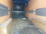 an image of the inside of a van with the door open