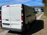 a white van that is parked on the side of the road