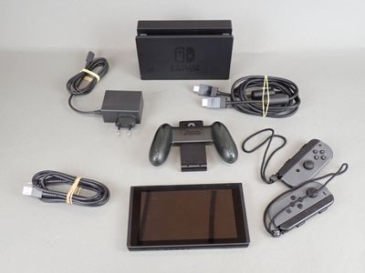 a nintendo wii game system and accessories laid out on a table