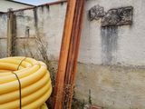 a yellow hose sitting next to a pile of yellow hoses
