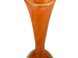 a small vase that is sitting on a white surface