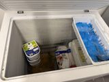 a cooler that has a lot of food inside of it