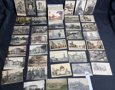 a lot of old postcards that are on a table