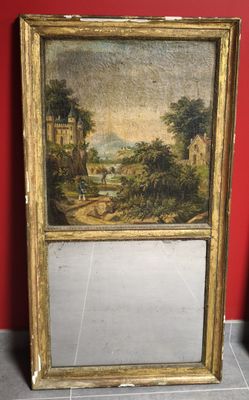 tableau représentant un paysage, dans un cadre doré, accroché à un mur rouge