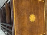 a wooden box that has a clock on top of it