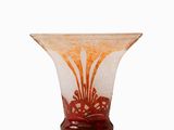 a glass vase with a design on it on a white surface