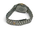 a watch that is sitting on a bracelet on a white surface
