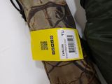 a camouflage umbrella with a yellow tag on it