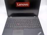 a laptop with a lenovo logo on the screen