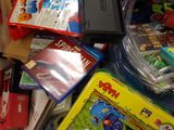 a pile of children ' s toys and books on the floor