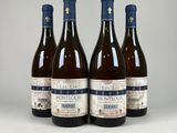 three bottles of wine sitting on top of a white table
