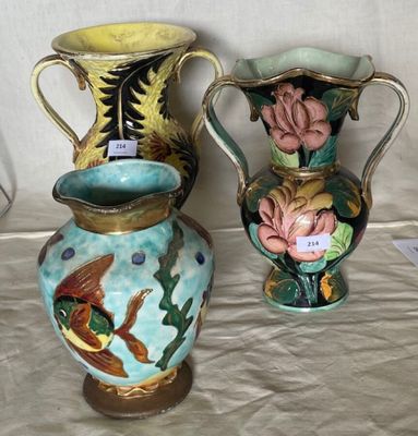two vases sitting next to each other on a table