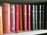 many books that are on a shelf in the room