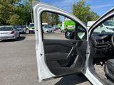 a white car with its door open in a parking lot