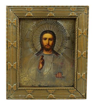 une image représentant un tableau de Jésus dans un cadre doré
