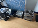 many trays of food sitting on the floor next to a wall